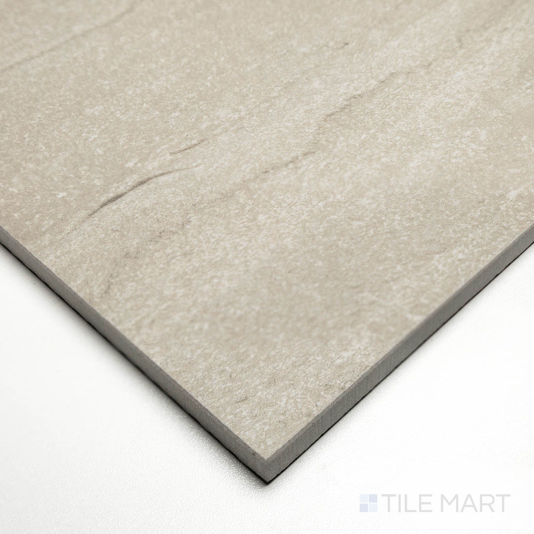 Angled image of Dorset Vein Cut Tortora 24x48 tile featuring muted taupe coloration with natural striations.