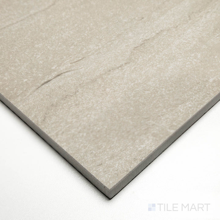 Angled image of Dorset Vein Cut Tortora 24x48 tile featuring muted taupe coloration with natural striations.