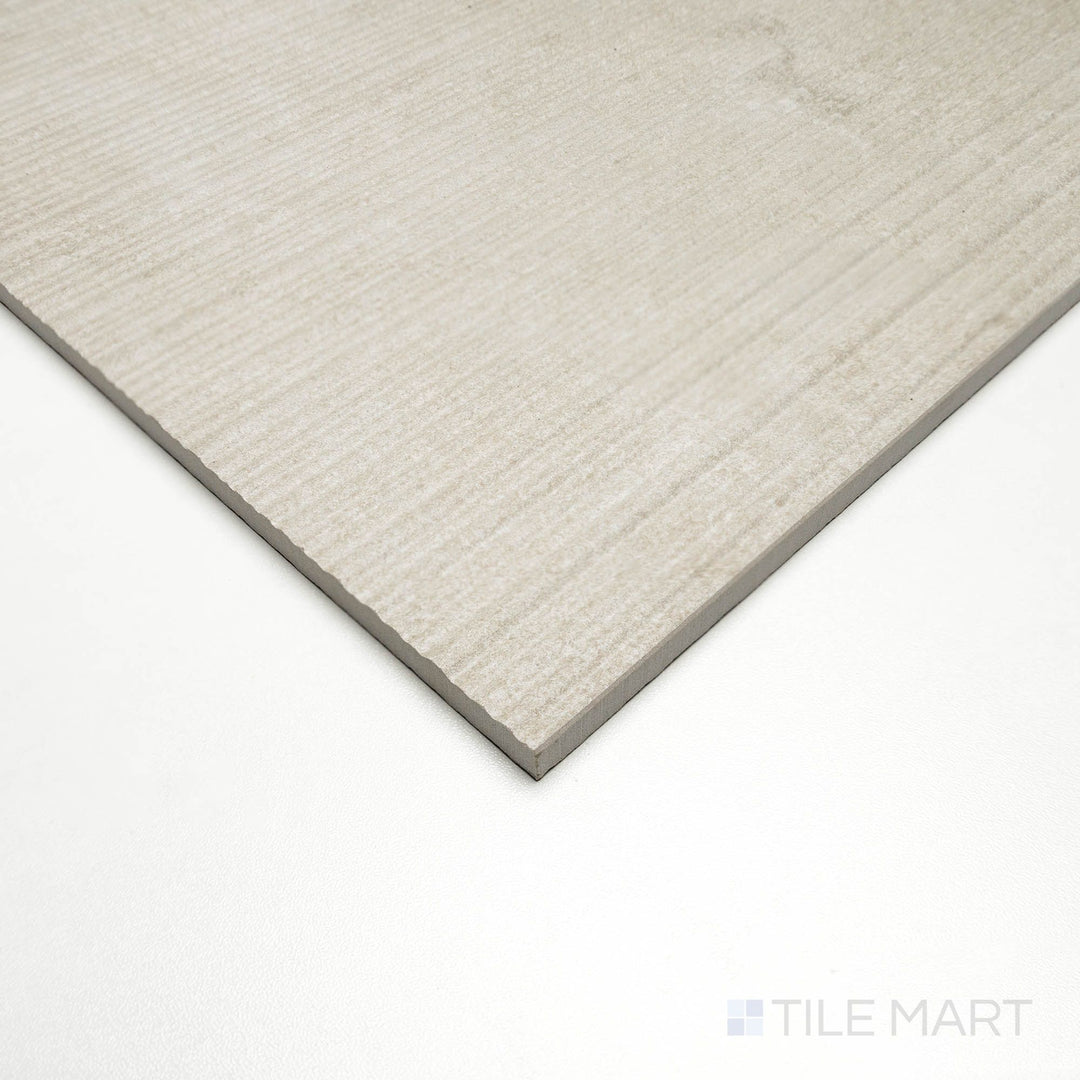 Corner angle showing Dorset Ribbed Beige 24x48 tile with textured linear ridges and warm beige tones.