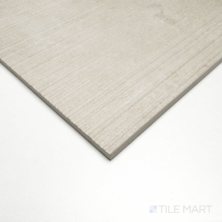 Corner angle showing Dorset Ribbed Beige 24x48 tile with textured linear ridges and warm beige tones.