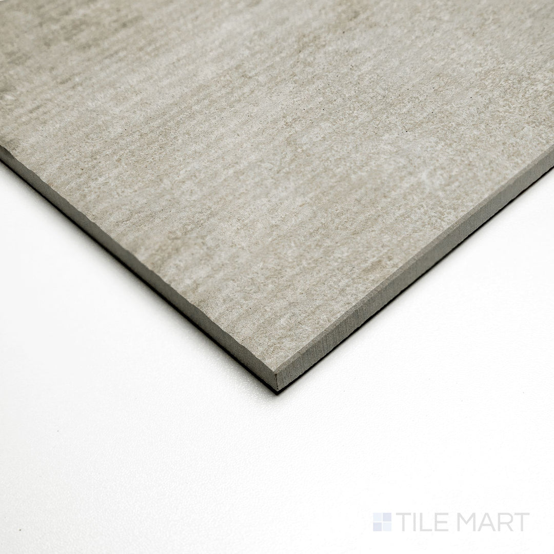 Angled view of Dorset Ribbed Tortora 24x48 tile displaying soft taupe lines with a ribbed surface detail.