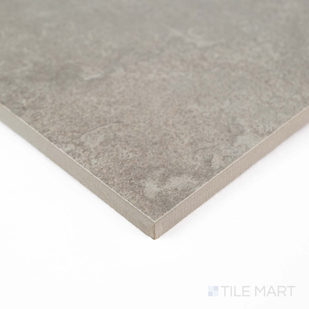 Corner view of Dorset Cross Cut Cenere 48x48 Matte Porcelain Tile showcasing cool gray shades and realistic cross-cut stone detailing – perfect for expansive, modern interiors.