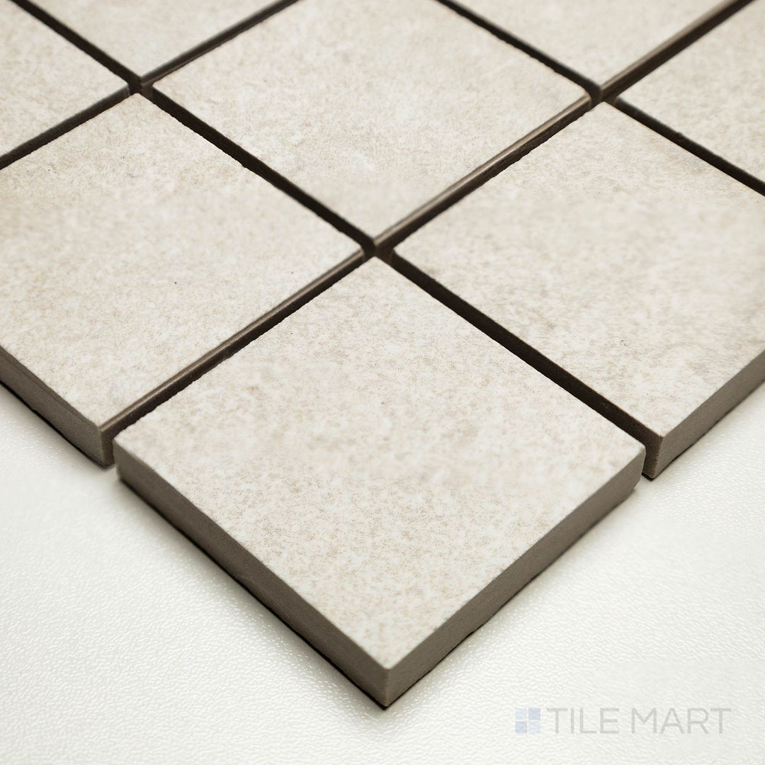 Corner shot of Dorset Cross Cut Bianco 2" square mosaic showing small white tiles with soft cross-cut patterning.