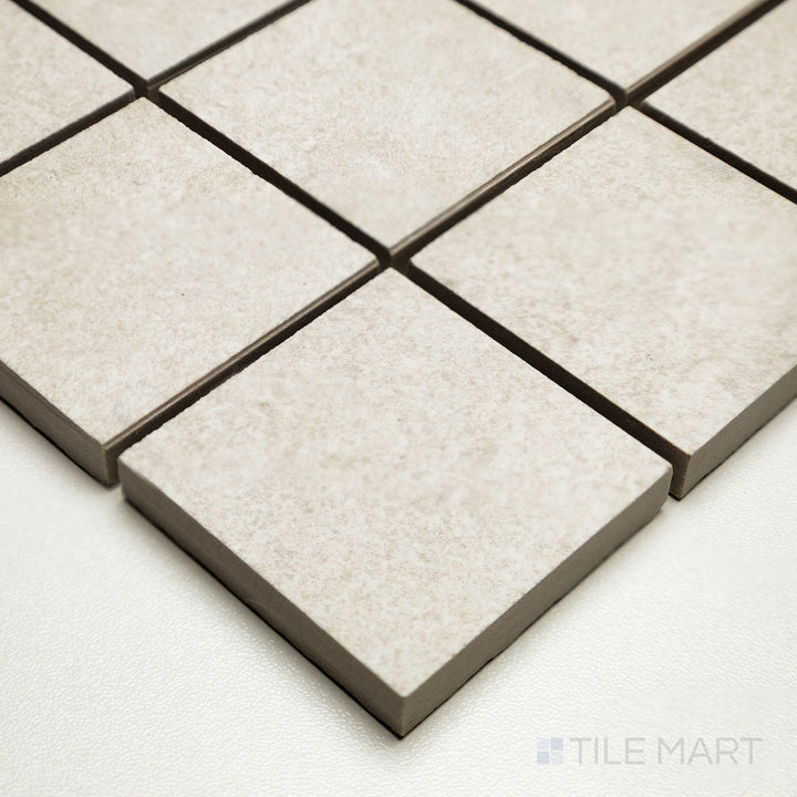 Corner shot of Dorset Cross Cut Bianco 2" square mosaic showing small white tiles with soft cross-cut patterning.