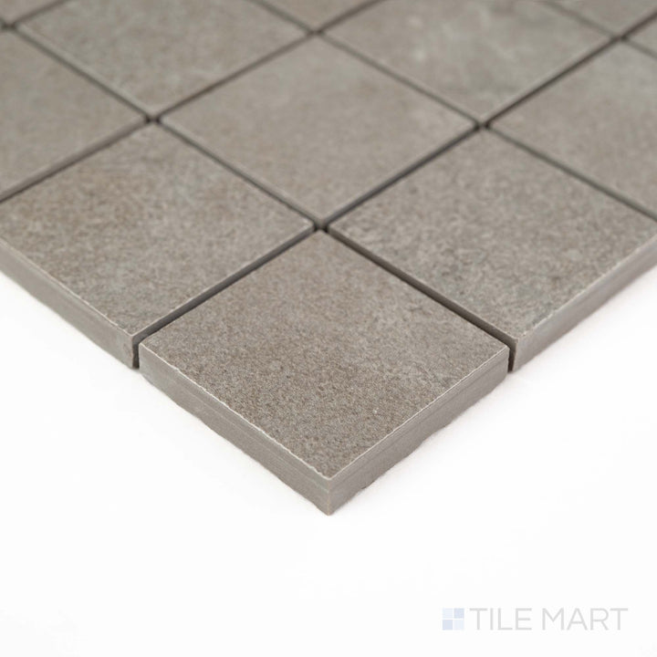 Corner shot of Dorset Cross Cut Cenere 2" Square Matte Porcelain Mosaic with subtle gray tones and a stone-look pattern – ideal for spa-inspired surfaces and mosaic inlays.