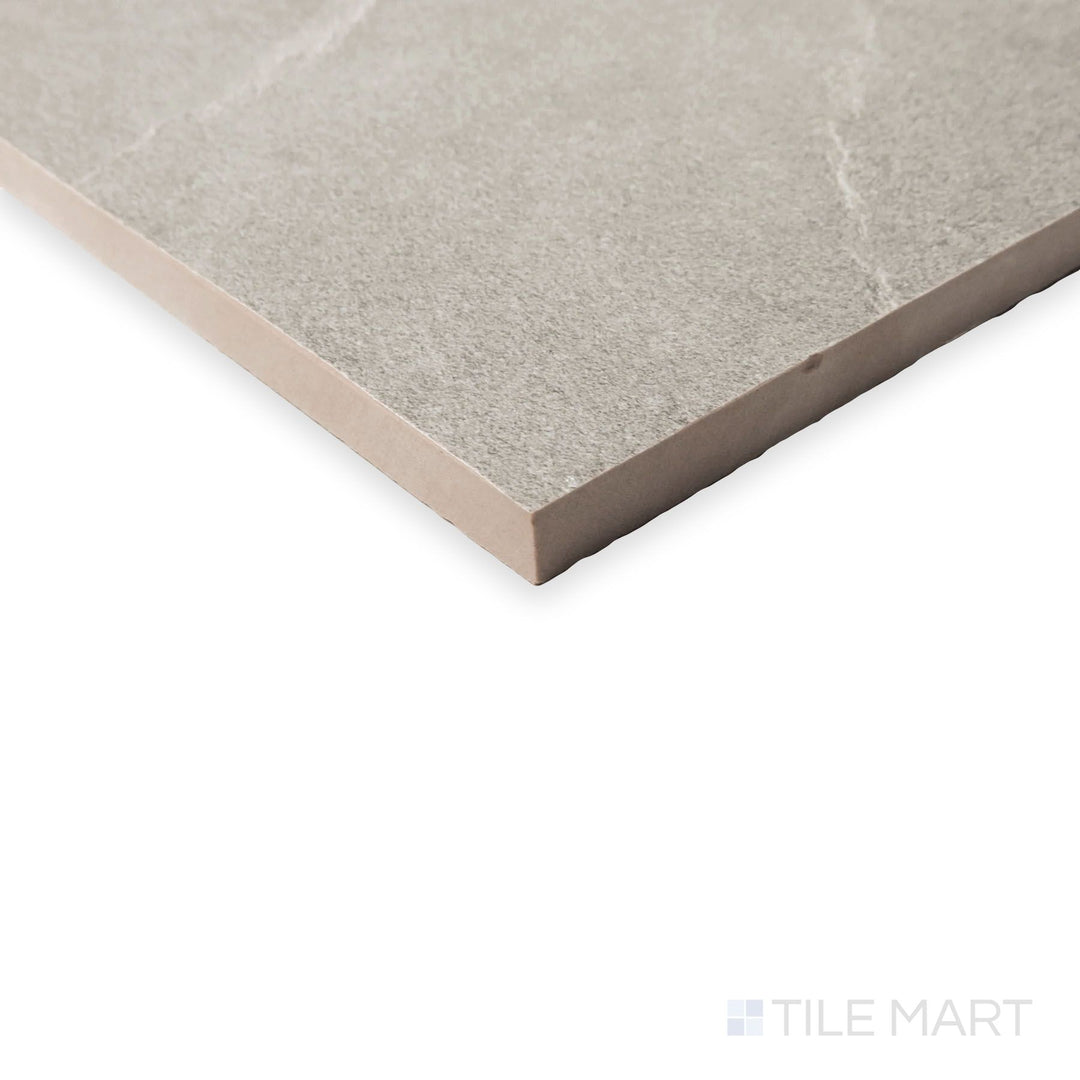 Side-angled shot of Hurricane Silver 24x48 tile revealing cool metallic gray hues and soft texture variation.