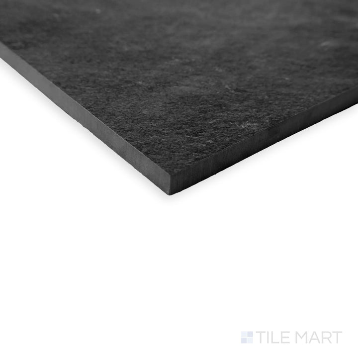 Corner detail of Hurricane Smoke 24x48 tile with rich charcoal tones and smooth matte surface.