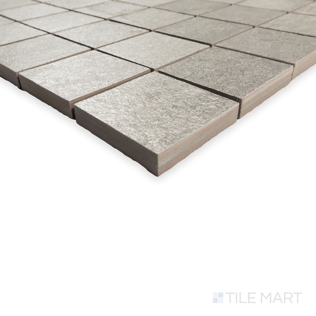 Corner view of Hurricane Silver 2" square mosaic featuring a grid of soft silver tiles with natural texture.