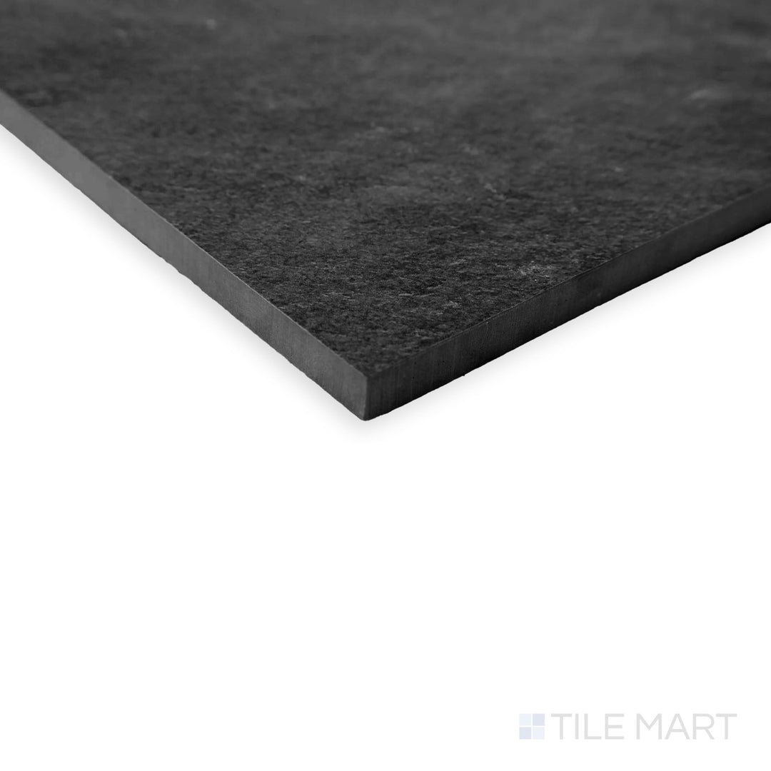 Oblique view of Hurricane R11 Grip Smoke 12x24 tile showing bold charcoal tone with anti-slip texture.