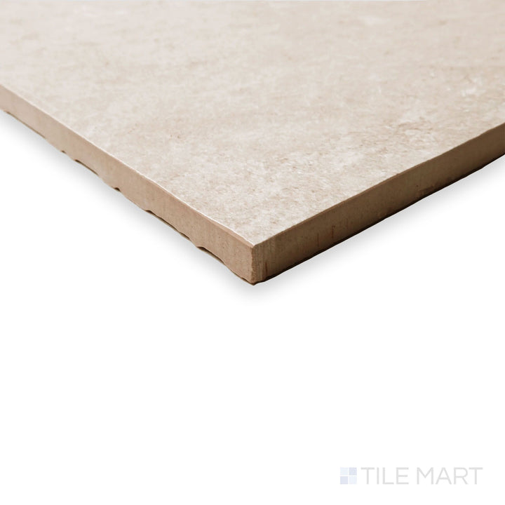 Edge detail of Hurricane R11 Grip Sand 24x24 tile featuring soft beige coloration with structured surface grip.