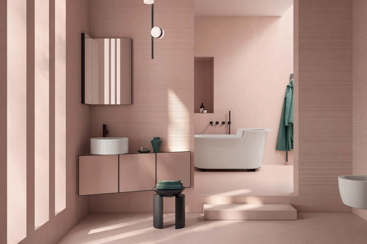 Room styled with Nuances Rose 24x48 Matte Porcelain Tile, featuring a soft blush hue and a smooth matte finish for a warm, modern aesthetic.