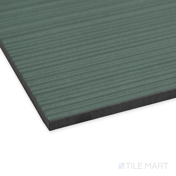 Angled shot of Nuances Ribbed Giada 24x48 tile featuring delicate ribbed detailing and a soft jade green tone.