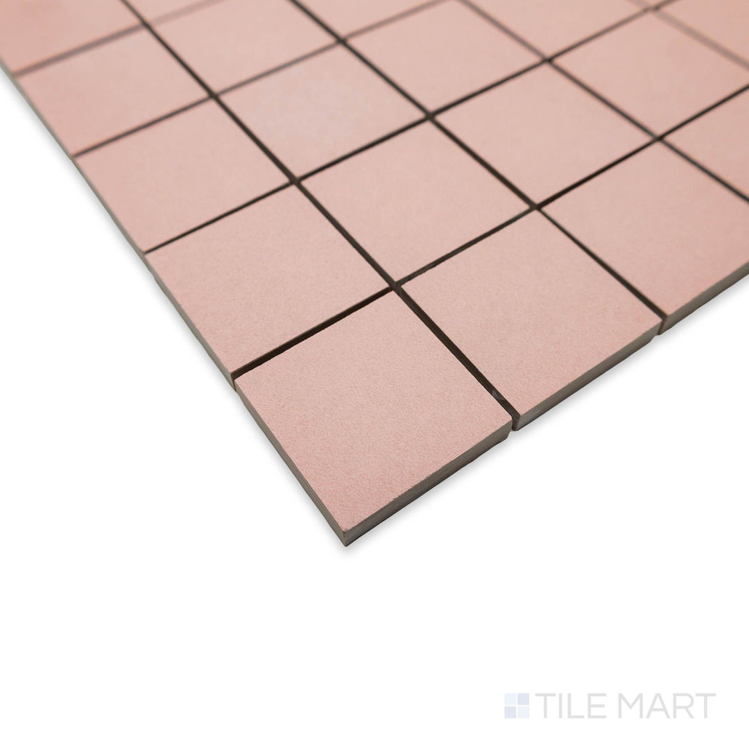 Corner view of Nuances Rose 2" square mosaic tiles capturing soft pink hues and uniform matte finish.