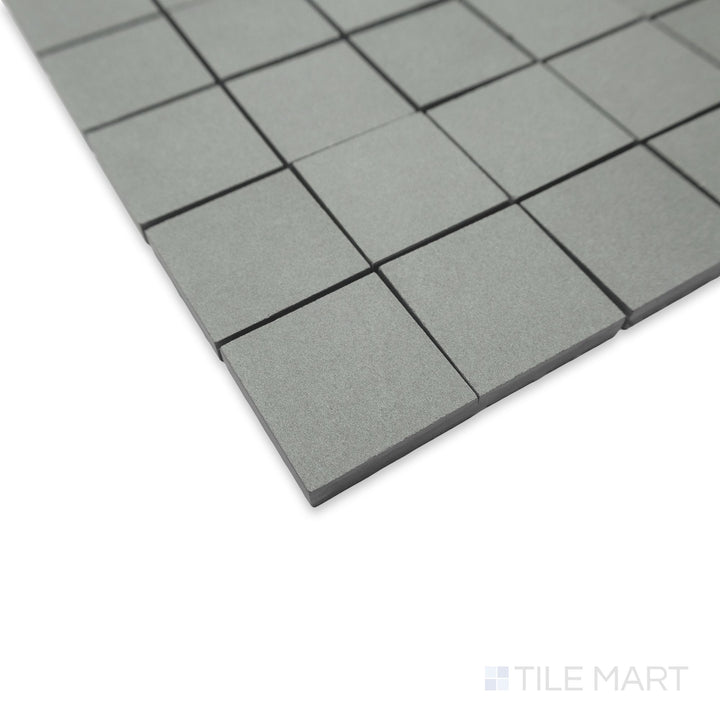 Angled close-up of Nuances Salvia 2" square mosaic with a gentle sage green tone and smooth surface.