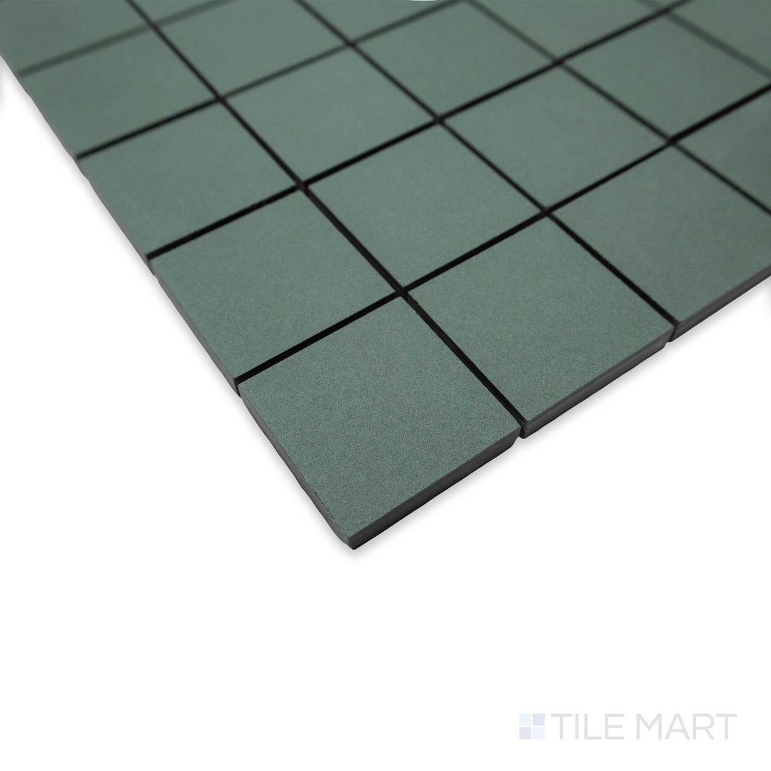 Corner perspective of Nuances Giada 2" square mosaic tiles showcasing serene green coloring and matte appeal.