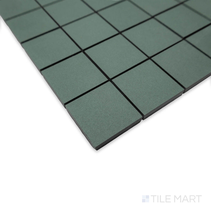 Corner perspective of Nuances Giada 2" square mosaic tiles showcasing serene green coloring and matte appeal.