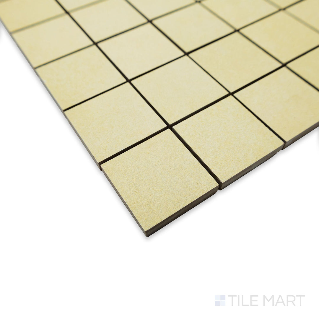 Side angle of Nuances Luce 2" square mosaic tiles featuring a calm off-white tone and fine craftsmanship.