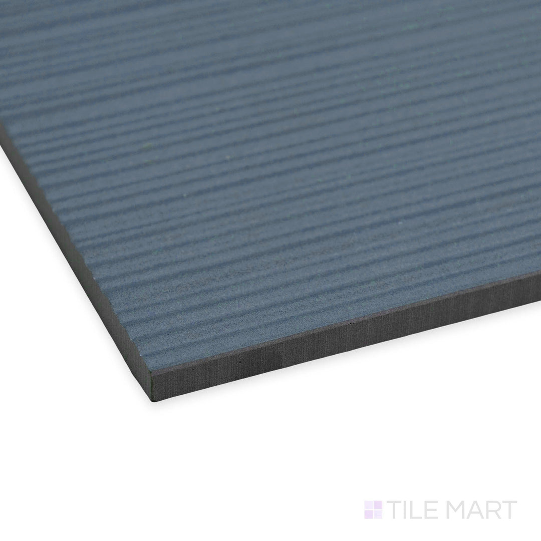 Side perspective of Nuances Ribbed Cielo 24x48 tile revealing its subtle vertical ribbing and cool sky-inspired finish.