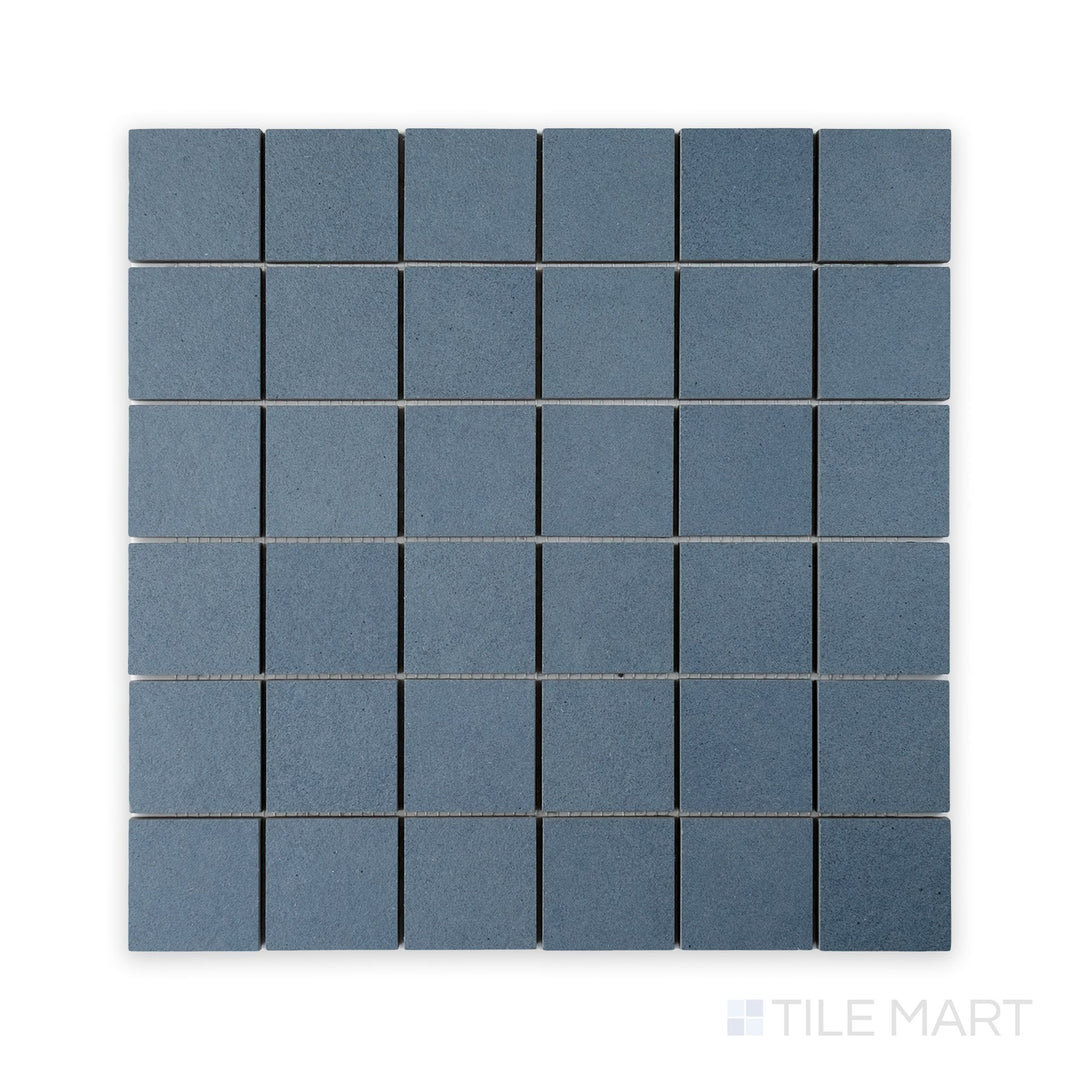 Straight-on mosaic shot of Nuances Cielo 2" Square Matte Porcelain Mosaic, showing gentle blue square segments designed for accent walls or feature zones.