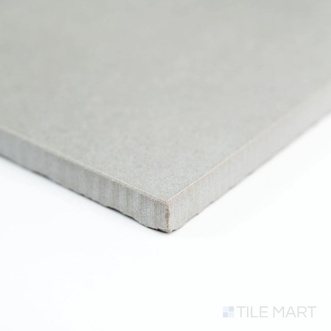 Corner view of Nuances Grigio 24x48 matte tile highlighting its modern gray tone and understated sophistication.