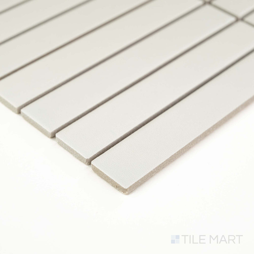 Corner view of Passaggi White 1x6 Grid Matte Porcelain Mosaic showcasing sleek white rectangular pieces arranged in a modern grid – perfect for backsplashes and shower walls.