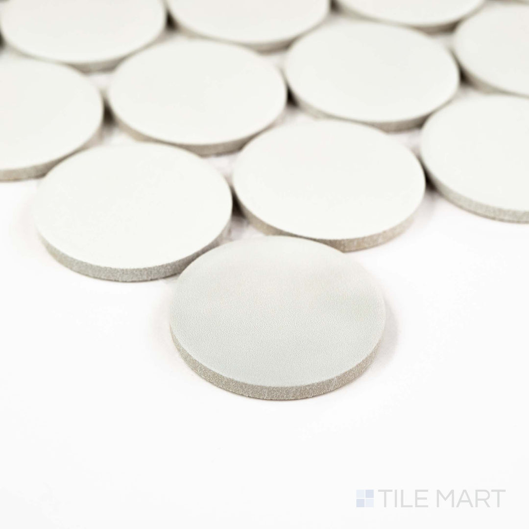 Corner shot of Passaggi White 2" Round Matte Porcelain Mosaic featuring soft white penny rounds with a smooth matte finish – ideal for vintage or contemporary accents.