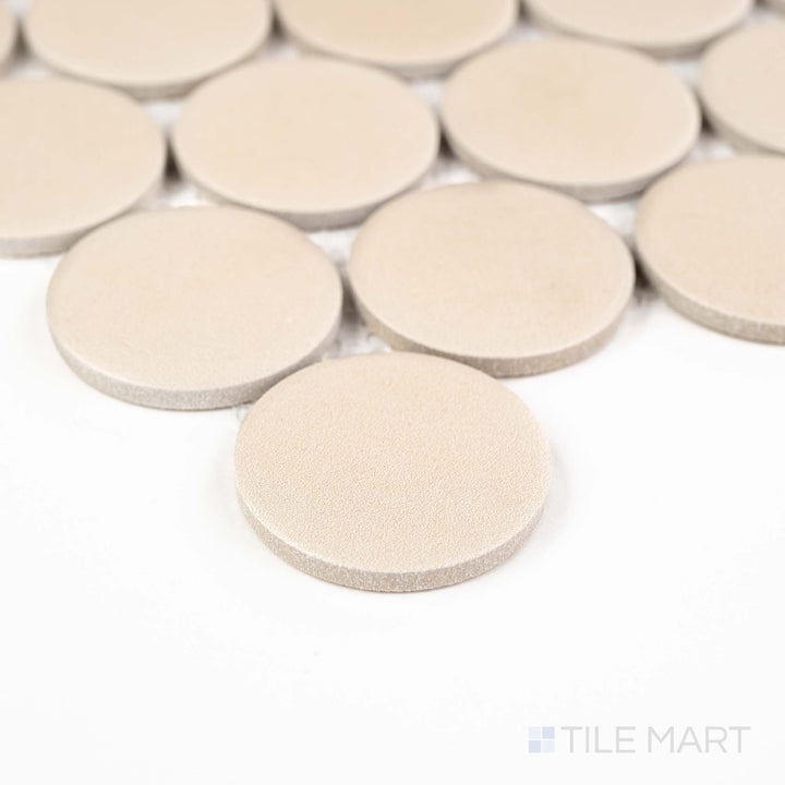 Corner angle of Passaggi Beige 2" Round Matte Porcelain Mosaic with earthy beige hues and a timeless penny round format – perfect for floors and feature niches.