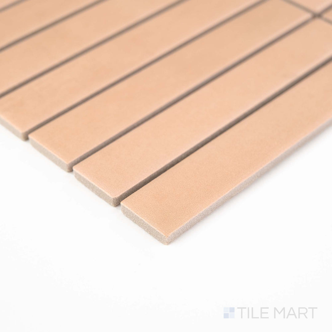 Corner view of Passaggi Blush 1x6 Grid Matte Porcelain Mosaic featuring soft pink tones in a sleek, linear grid layout – perfect for romantic and playful interiors.