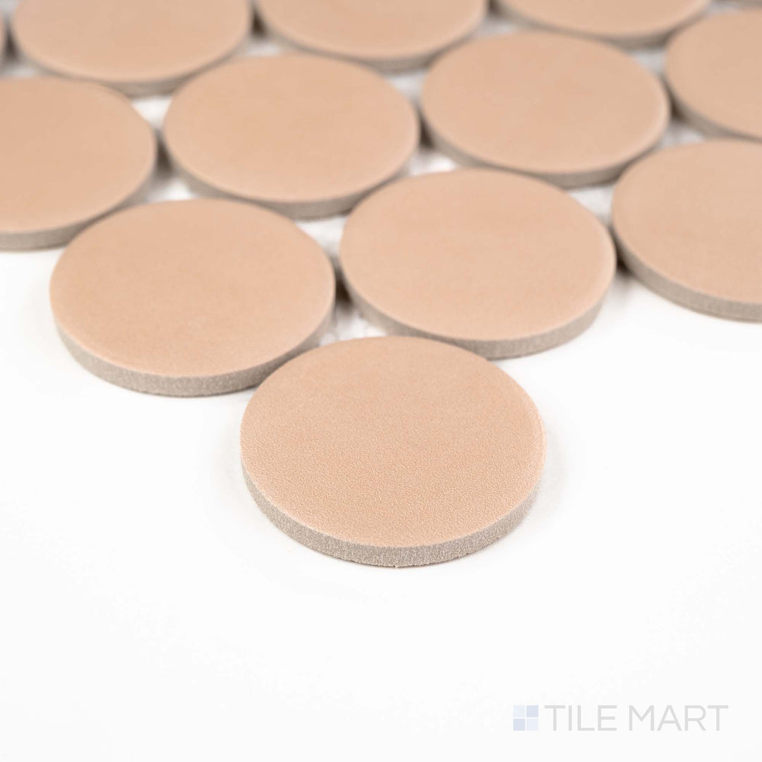 Corner shot of Passaggi Blush 2" Round Matte Porcelain Mosaic with warm blush penny rounds and a matte finish – ideal for accent walls or creative bathroom designs.
