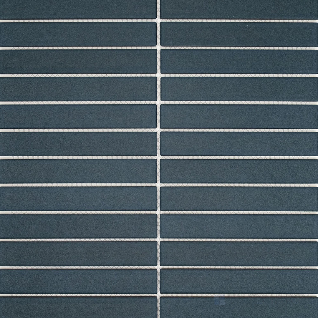 Surface view of Passaggi Blue 1x6 Grid Matte Porcelain Mosaic Tile showcasing subtle blue hues, grid arrangement of narrow tiles, and modern matte finish.