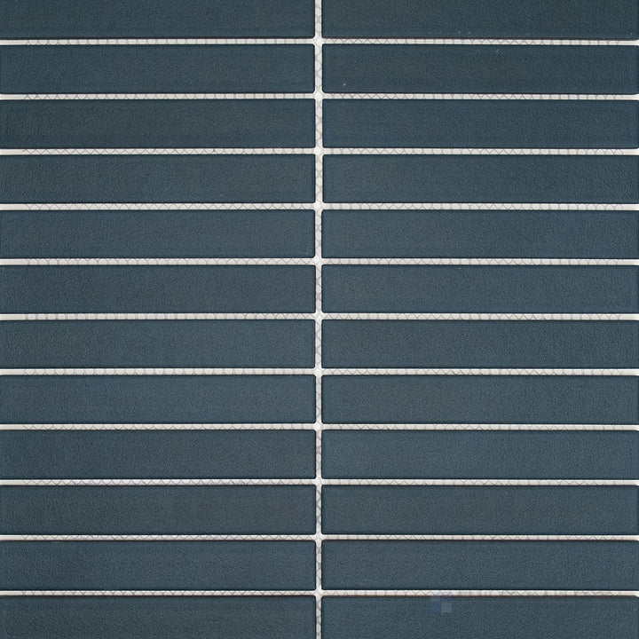 Surface view of Passaggi Blue 1x6 Grid Matte Porcelain Mosaic Tile showcasing subtle blue hues, grid arrangement of narrow tiles, and modern matte finish.