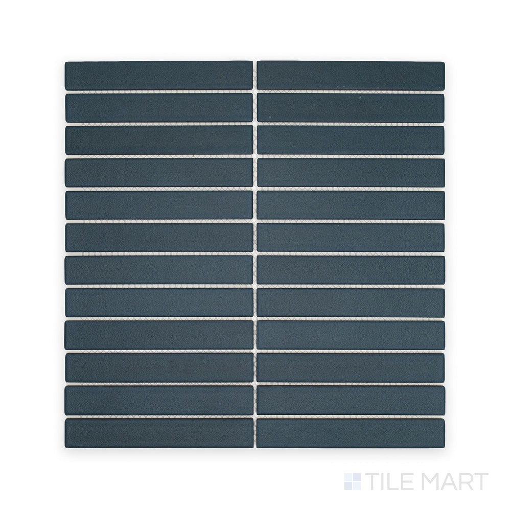 Overhead composition of Passaggi Blue 1x6 Grid Matte Porcelain Mosaic, presenting narrow blue matte pieces arranged in a clean, structured layout perfect for coastal or modern designs.