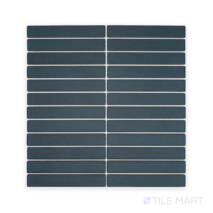 Overhead composition of Passaggi Blue 1x6 Grid Matte Porcelain Mosaic, presenting narrow blue matte pieces arranged in a clean, structured layout perfect for coastal or modern designs.