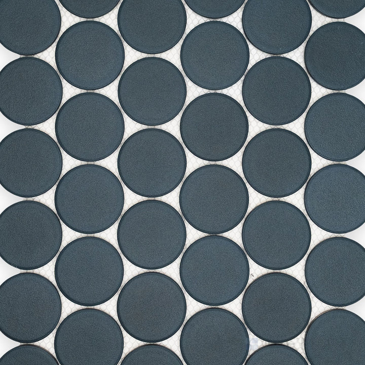Overview of Passaggi Blue 2" Round Matte Porcelain Mosaic Tile highlighting cool blue tones, round matte porcelain chips, and a soft, calming appearance.