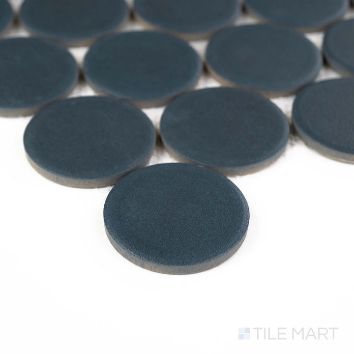Corner shot of Passaggi Blue 2" Round Matte Porcelain Mosaic showcasing soft blue penny rounds in a matte finish – great for beachy, tranquil, or whimsical interior touches.