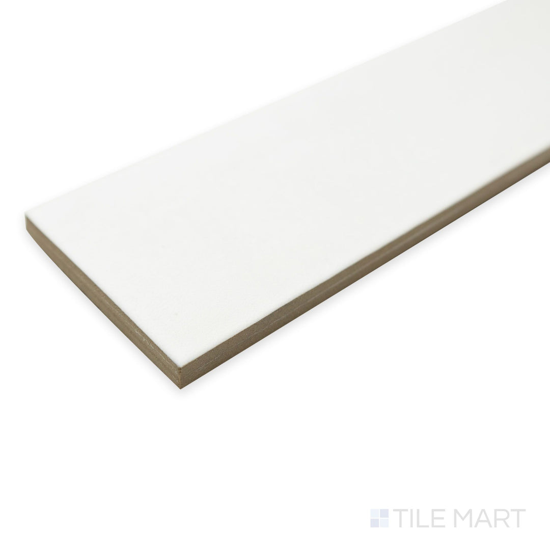 Corner perspective of Passaggi White 2x9 porcelain tile highlighting its bright neutral tone in an elongated rectangular format.