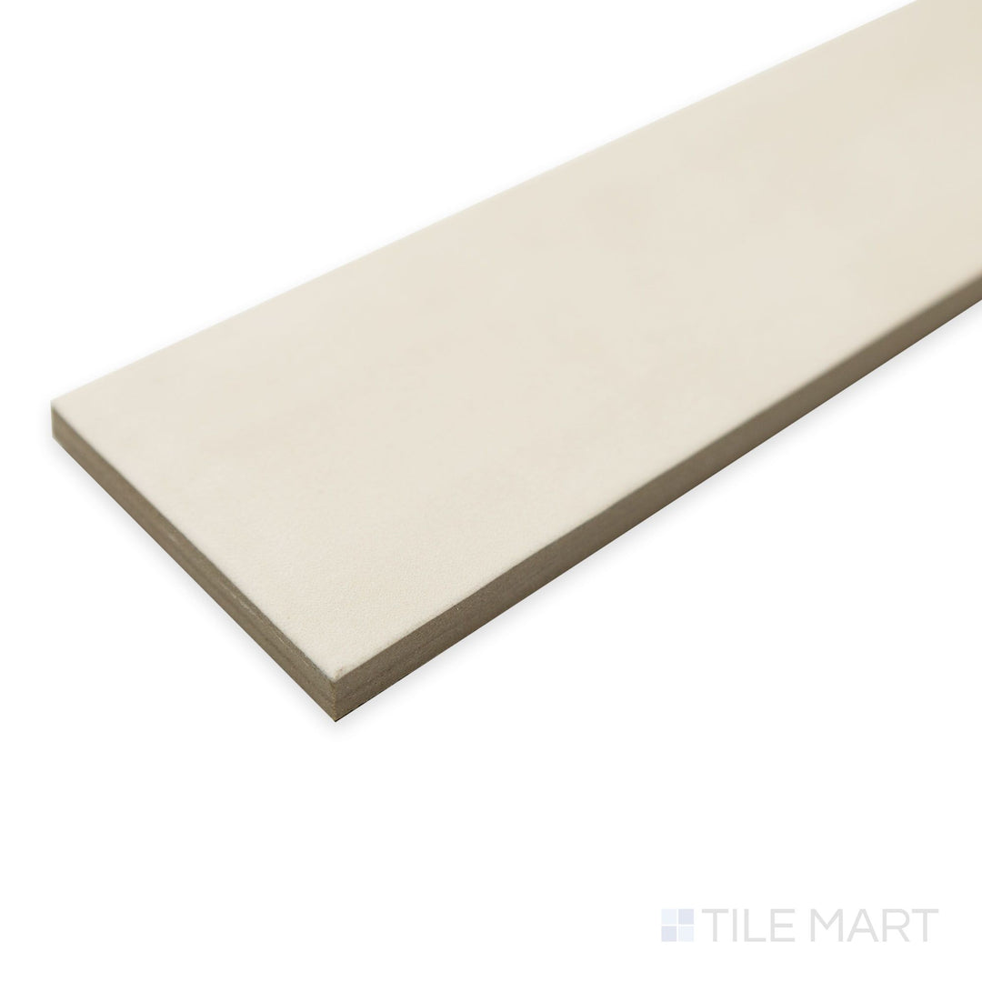 Angled shot of Passaggi Beige 2x9 porcelain tile featuring earthy beige tones and a sleek matte surface.