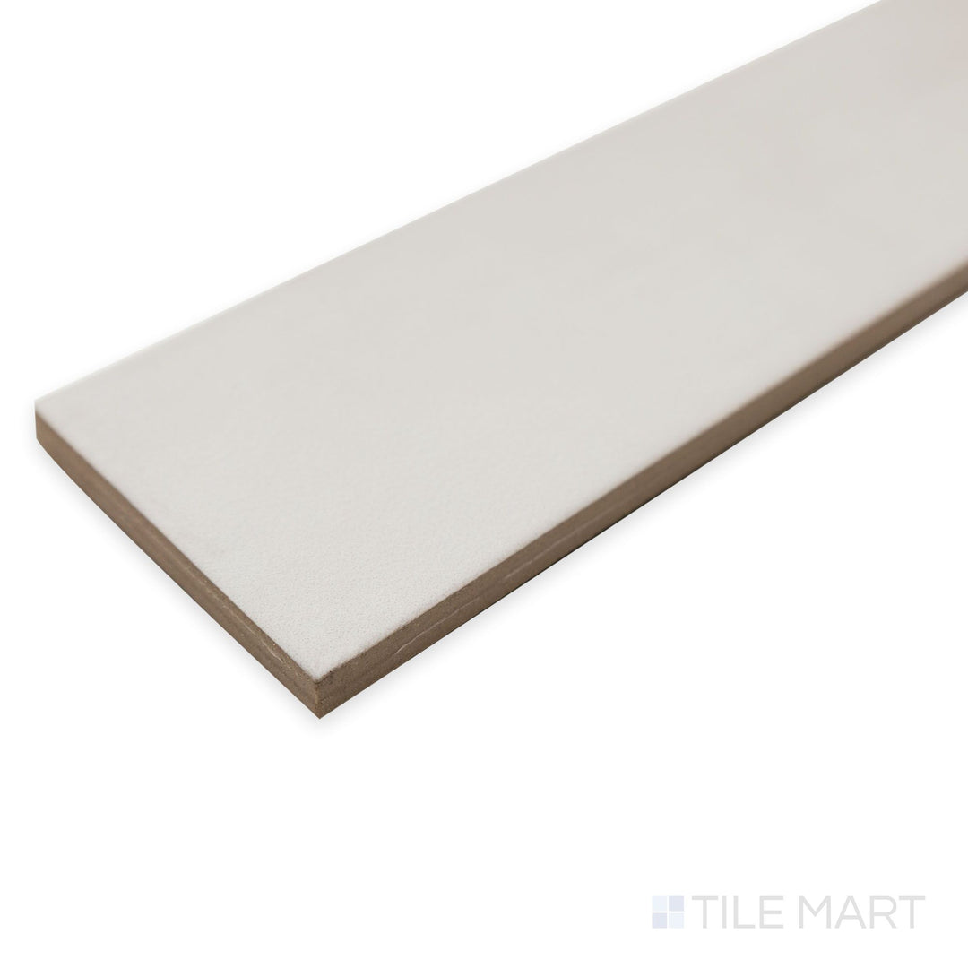 Corner view of Passaggi Grey 2x9 porcelain tile showing a balanced gray hue with a smooth, modern finish.