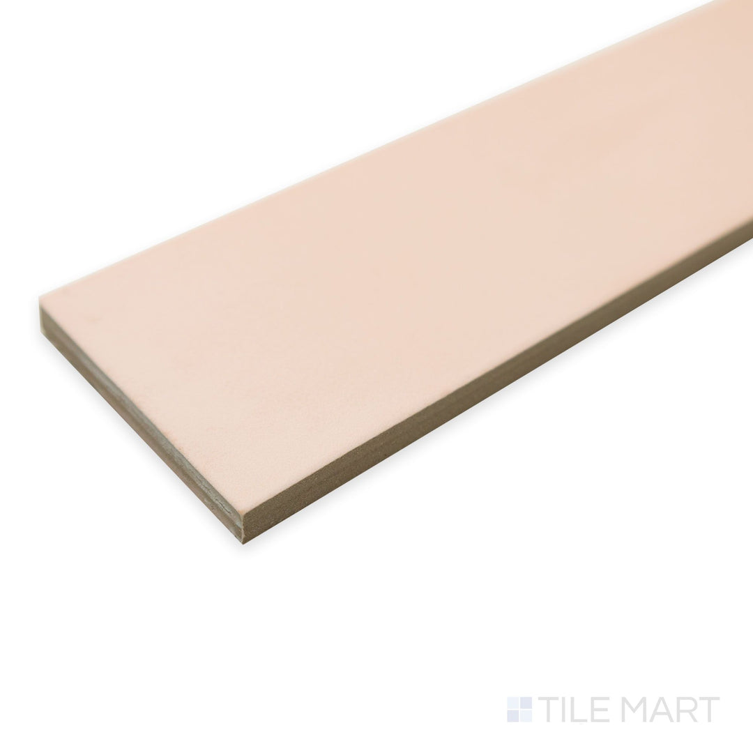 Oblique image of Passaggi Blush 2x9 porcelain tile capturing its subtle pink warmth in a slim, linear design.