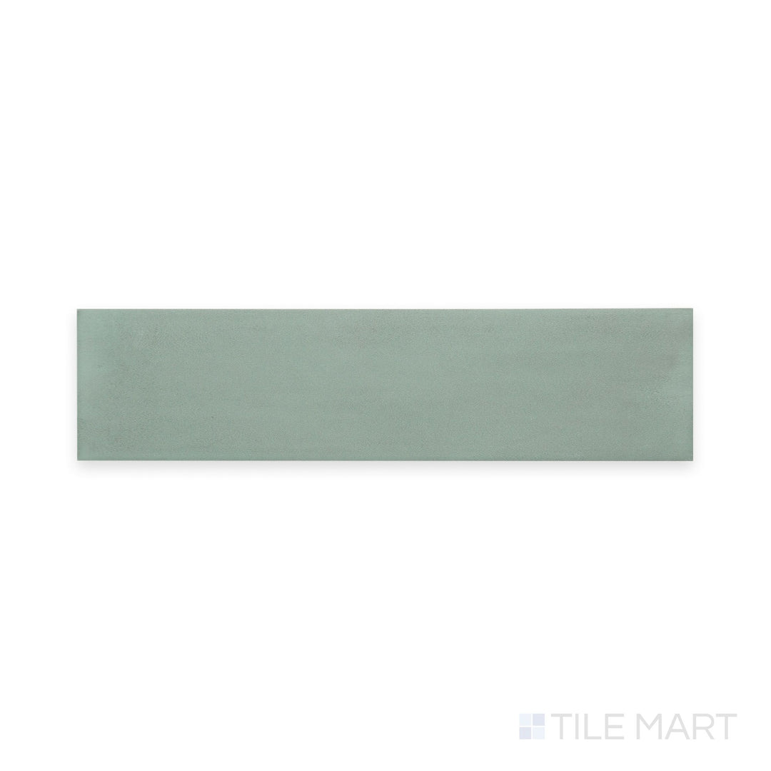 Straight-overhead angle of Passaggi Green 2x9 Matte Porcelain, showcasing tranquil green tones in a slim profile ideal for nature-inspired designs and spa-like environments.