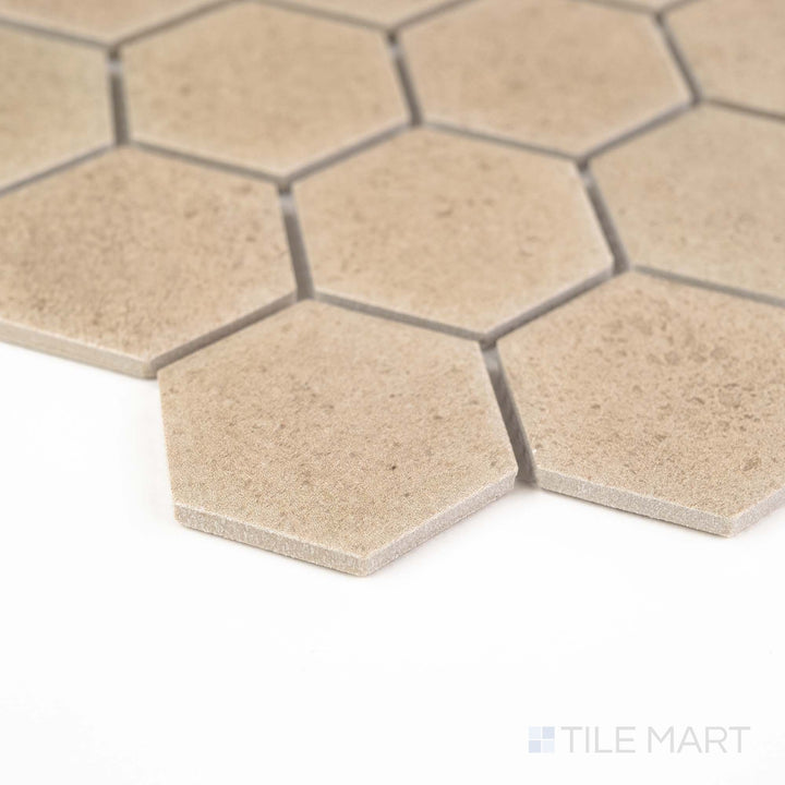 Corner view of Richmond Taupe 2" Hexagon Matte Porcelain Mosaic featuring warm taupe tones in a classic hexagonal pattern – ideal for stylish floors or backsplashes.