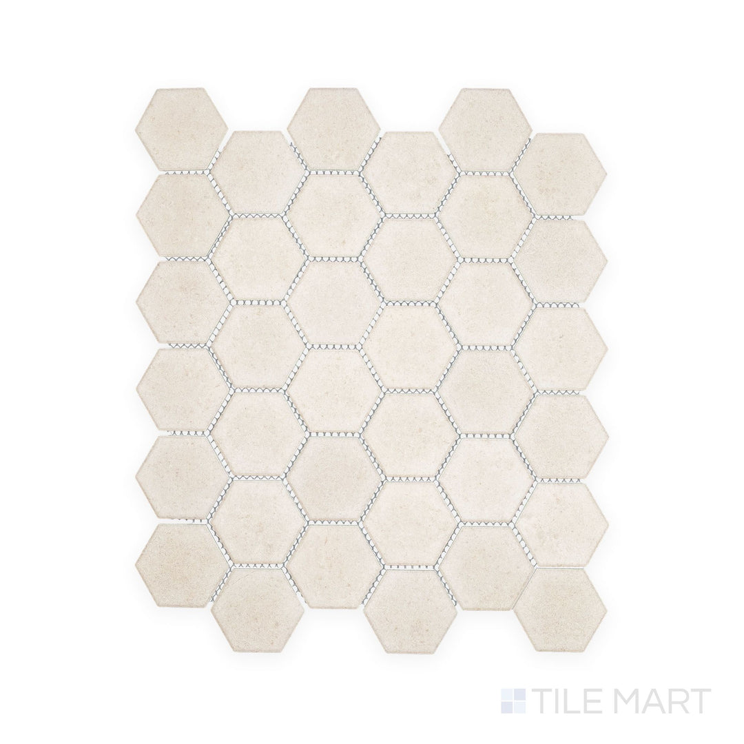 Overhead snapshot of Richmond Ivory 2" Hexagon Matte Porcelain Mosaic, featuring soft ivory shades and geometric detail to enhance backsplashes and bathroom floors.