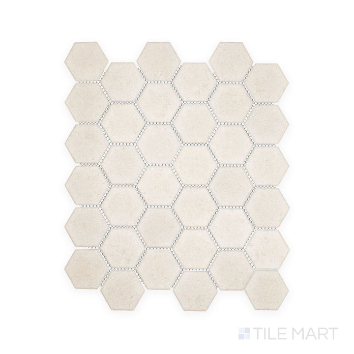 Overhead snapshot of Richmond Ivory 2" Hexagon Matte Porcelain Mosaic, featuring soft ivory shades and geometric detail to enhance backsplashes and bathroom floors.
