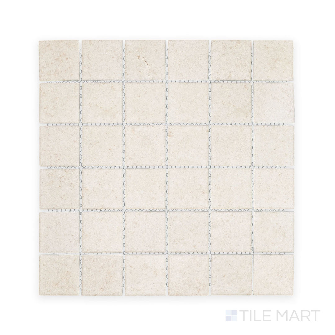 Tile shot from above showing Richmond Ivory 2" Square Matte Porcelain Mosaic, a neutral and adaptable surface choice for serene, spa-like environments.