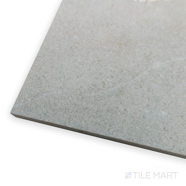 Corner shot of Richmond Silver 13X39 ceramic tile showing its sleek, contemporary finish in a cool gray shade.