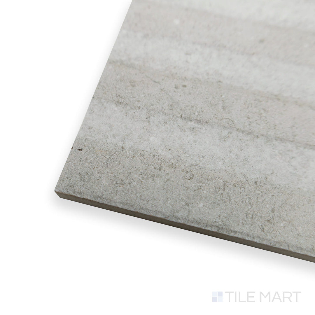 Angled view of Richmond Struttura 3D Silver ceramic tile revealing intricate raised textures and metallic undertones.