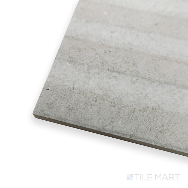 Angled view of Richmond Struttura 3D Silver ceramic tile revealing intricate raised textures and metallic undertones.