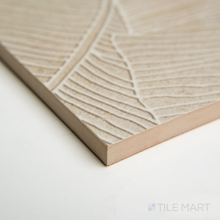 Corner angle of Richmond Deco Taupe Panta tile featuring artistic patterns layered on a taupe ceramic base.