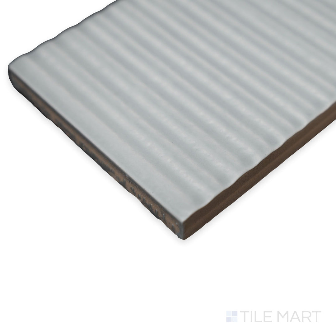 Oblique angle of Van Decor Oliva tile featuring a soft olive green base with raised decorative ceramic design.