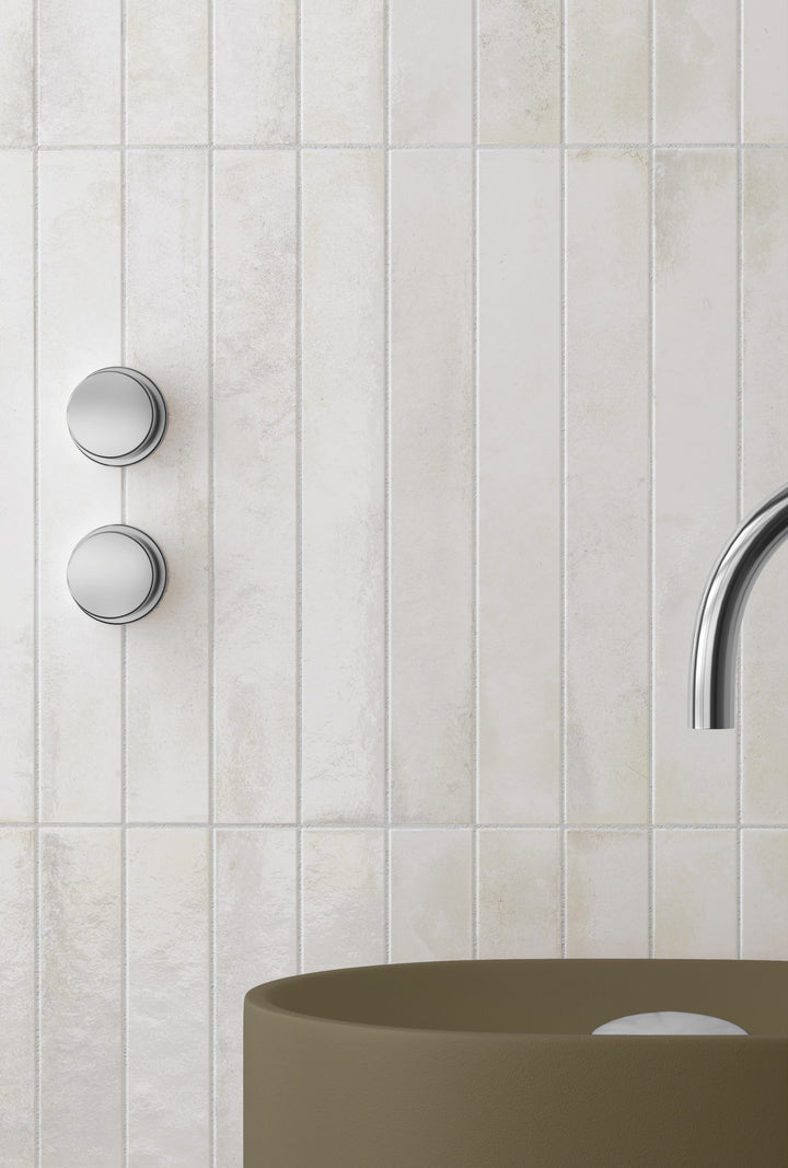 Bali White brings a crisp, airy brightness that lightens any glossy subway wall with clean, reflective appeal.